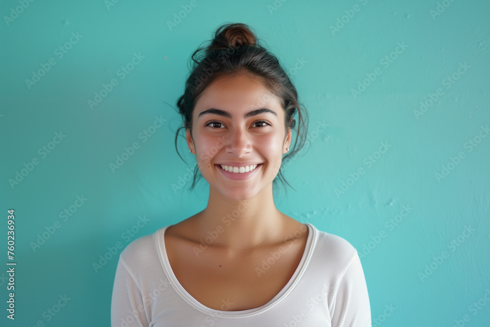 a woman with a white shirt and a blue wall a woman with a white shirt and a blue wall