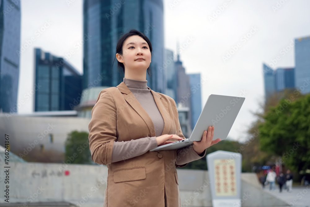 Confident Businesswoman Working on Laptop Outdoors Confident Businesswoman Working on Laptop Outdoors