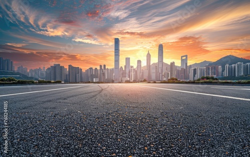 As posted by bokeh lighting  empty asphalt road and city skyline with sunset sky background