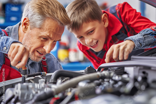 a father and son repairing a car engine in the garage