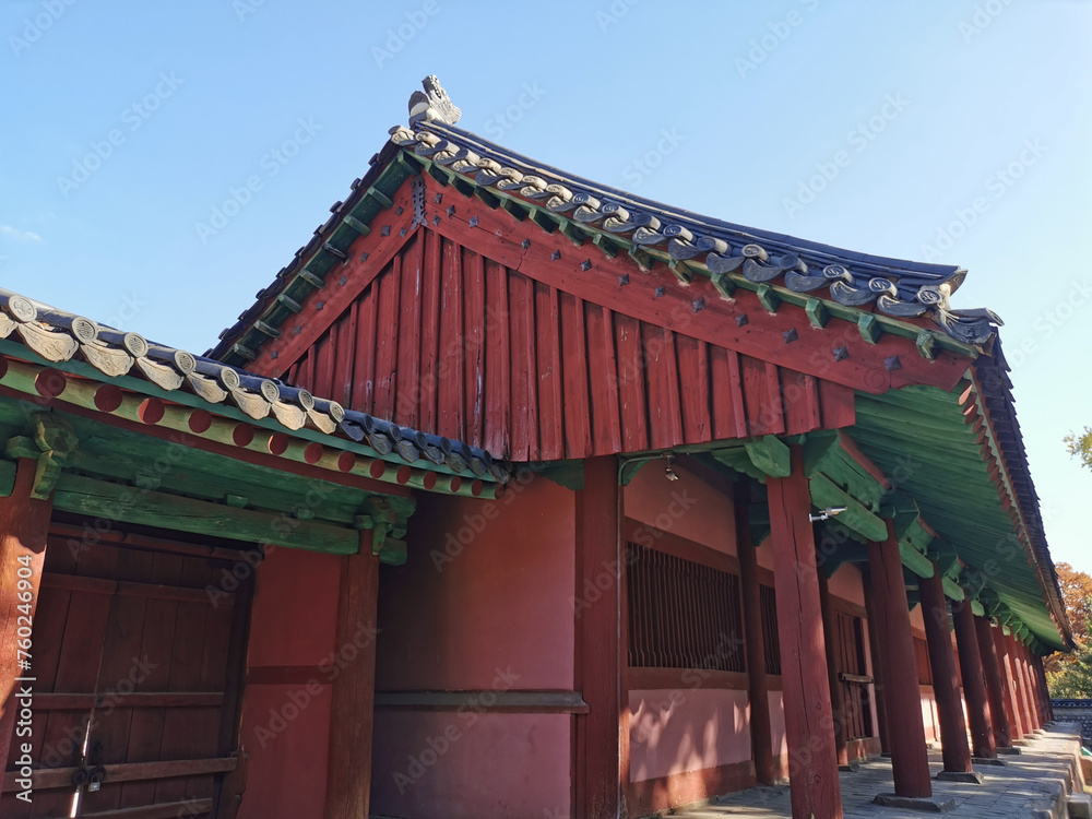 Fototapeta premium Traditional Korean Hanok Village buildings red brown doors in afternoon in Seoul, South Korea
