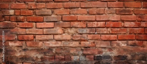 An intense closeup of a red brick wall showcasing multiple bricks neatly arranged in a square pattern with mortar in between each composite material