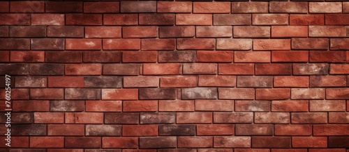 A detailed closeup of a rectangular red brick wall showcasing the intricate brickwork pattern, shades of brown, and symmetrical layout created by a skilled bricklayer