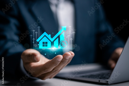 Real estate investment concept. Businessman using laptop to analyzing mortgage loan home and insurance real property mortgage. interest rate, Investment planning.