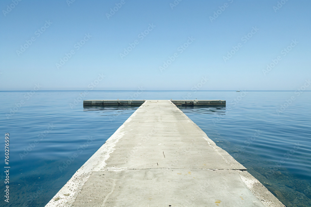 a concrete pier extending into the ocean