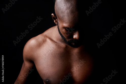 Black man, muscle and fitness with shadow for workout or exercise on a dark studio background. Closeup of young African male person or bodybuilder with masculine or muscular body on mockup space