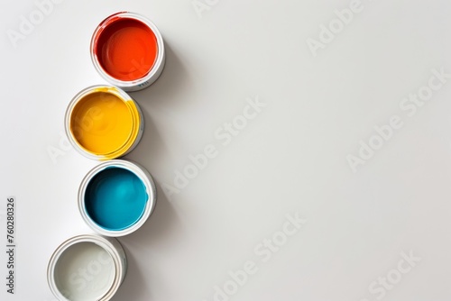 a few containers of paint on a white background with copyspace