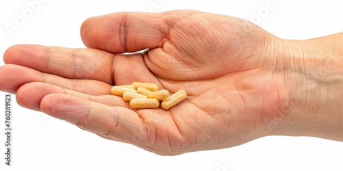 closeup male hand holding pills, isolated white background6