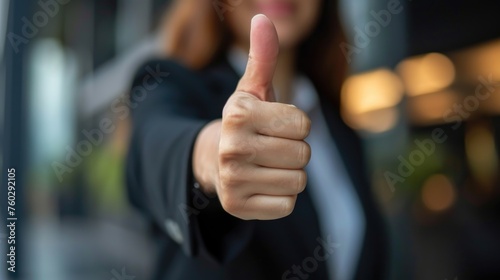 A businesswoman's hand points with a thumbs-up, signaling readiness and celebrating success, Ai Generated.