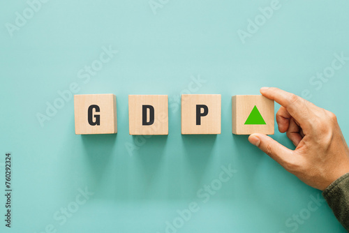 GDP percent change, Increasing GDP. Hand putting wooden block with arrow up sign for interest rate ,ranking and financial stocks