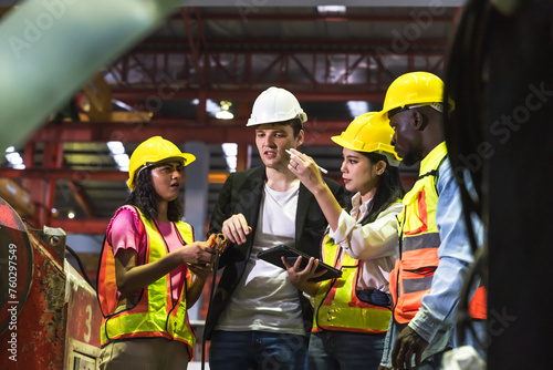 Group of diversity factory colleague worker man and woman discuss and brainstorming about work in inventory factory manufacturing 