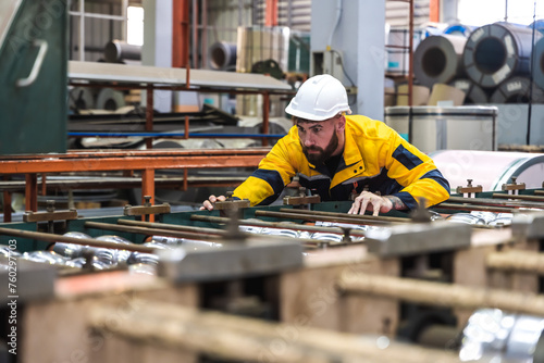 Expertise metal sheet engineer man working in metal manufacturing factory