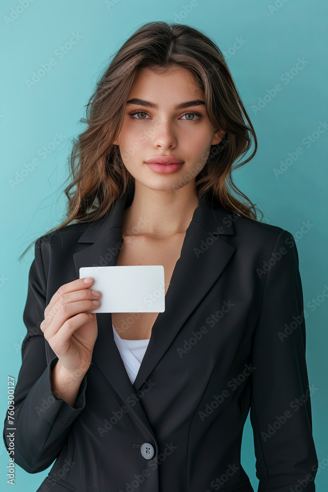 A beautiful businesswoman holding a blank piece of card A beautiful businesswoman holding a blank piece of card