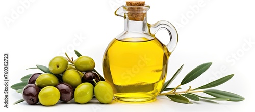 Fresh Olive Oil in a Glass Bottle with Green Olives and Leaves for Healthy Mediterranean Cuisine