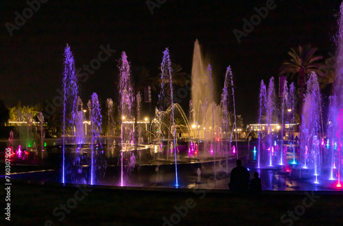 Enchanting grandiose musical performance - water and light show of a musical fountain on the embankment, in the center of the city of Eilat in southern Israel