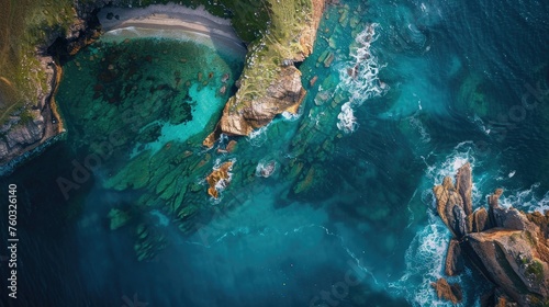 Top-down view of a rugged coastline, revealing the dynamic interaction between sea and land.