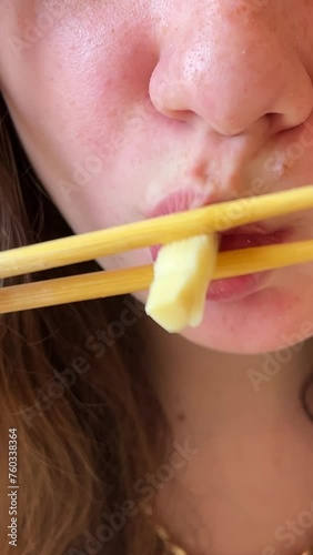 A young girl eats delicious pho bo soup with chicken in Vietnam in the mall fast cooking cheap food healthy traditional Vietnamese soup in Ho Chi Minh City. Saigon photo