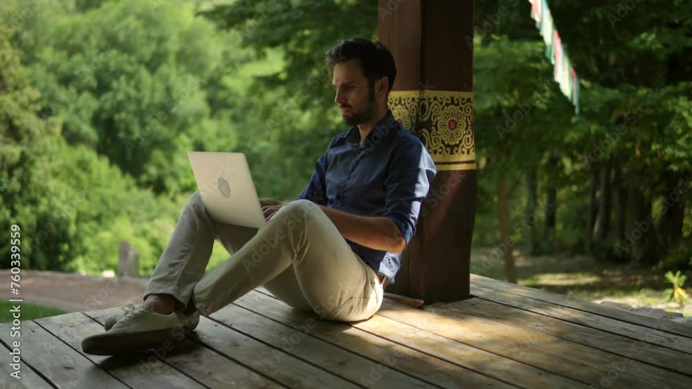 Freelancer attends an online meeting via webinar while working outdoors with her computer Freelancer attends an online meeting via webinar while working outdoors with her computer