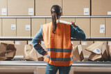 Angry rebellious worker smashing boxes in the workplace
