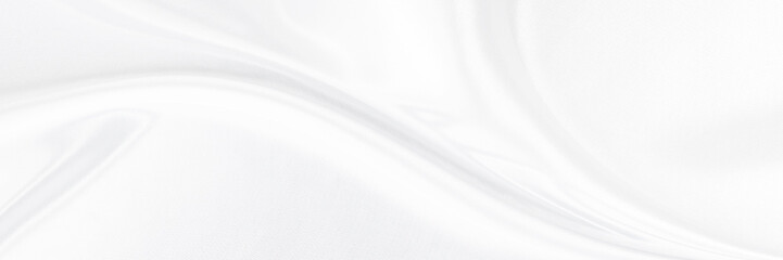 White gray satin texture that is white silver fabric silk panorama background with beautiful soft blur pattern natural.