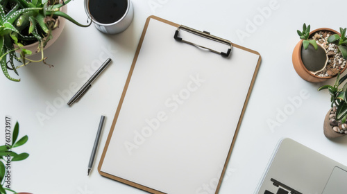 Minimalist workspace with clipboard and plants, neat and organized.