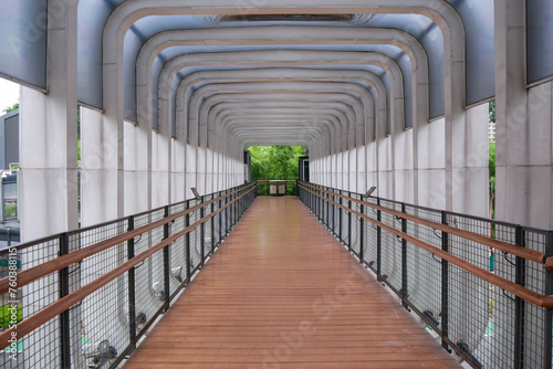 wide view of Pedestrian bridge over the Polda Metro Jaya Transjakarta bus stop photo