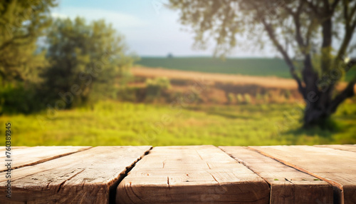 Empty rustic table in front of countryside background. product display and picnic concept with free space for text
