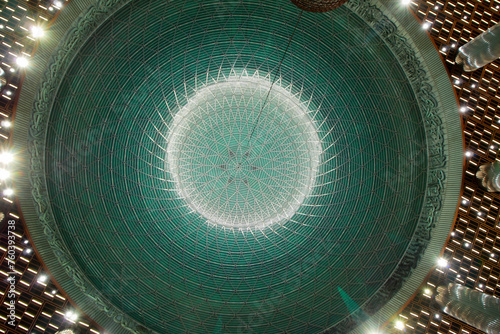 Silaban dome with beautiful rounded calligraphy in Istiqlal Mosque, Jakarta photo