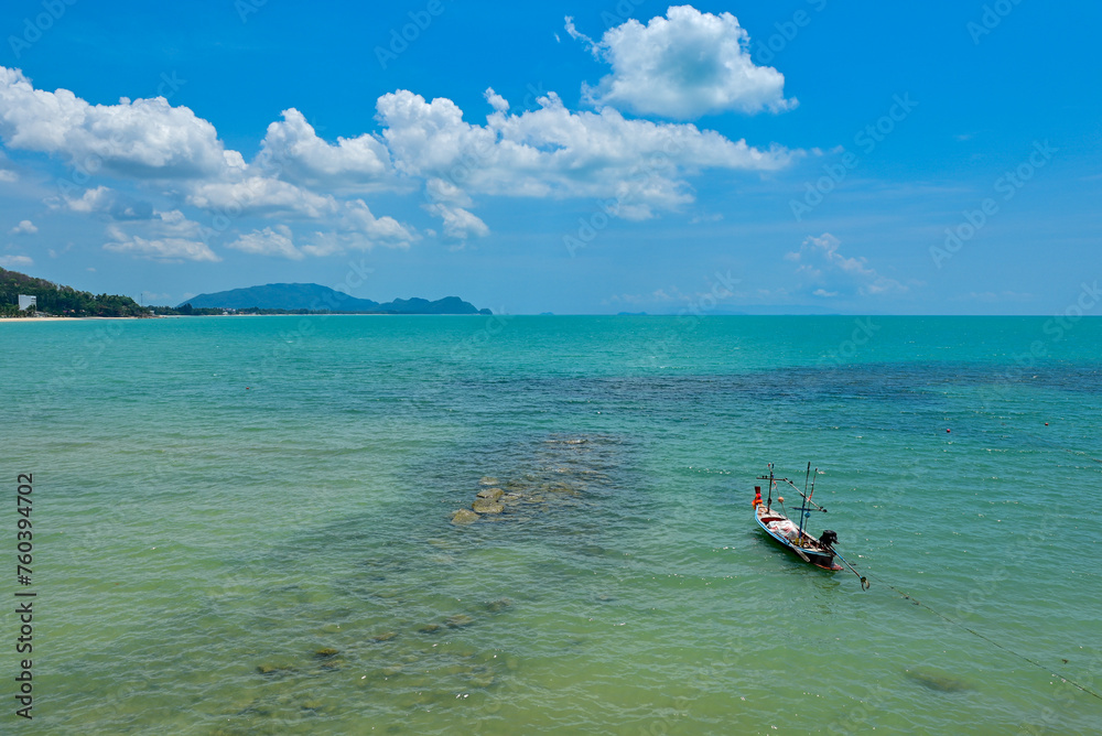 Long tail boat in the sea, Beautiful sea clear water, relaxing in your holiday at Khanom beach Nakhon si thammarat Thailand.