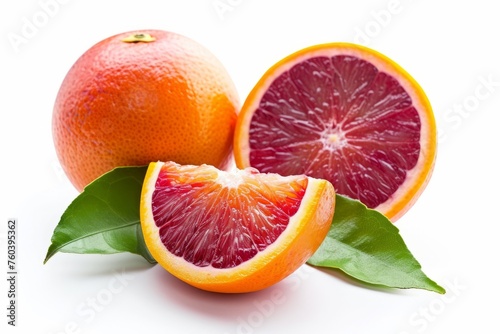 Juicy red orange with leaves isolated on a white background.