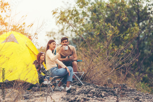Group tourism and travel hiker adventure on mountain nature landscape.  People lifestyle tourist backpack drinking coffee and camping outdoors for relax summer time.  Travel Concept