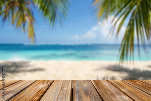 Wooden table with blurred bokeh light seascape and palm leaves at tropical beach background photo