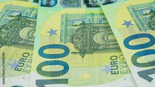 Several new100 euro bills, close up Cash money banknotes. . Finance and investment concept. Closeup shot. Currency exchange of one hundred euro. Rich business economy photo
