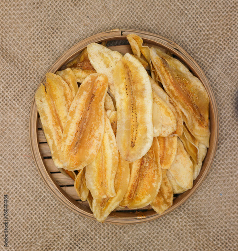 top view of Crispy Banana chips or Keripik pisang in indonesia, served in bamboo bowl