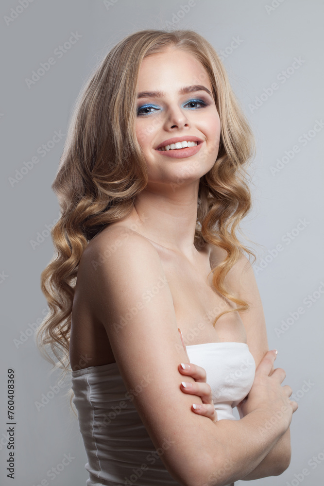 Happy blonde lady on white background. Beautiful blond woman studio portrait Happy blonde lady on white background. Beautiful blond woman studio portrait