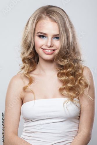 Joyful blonde beauty. Young woman portrait