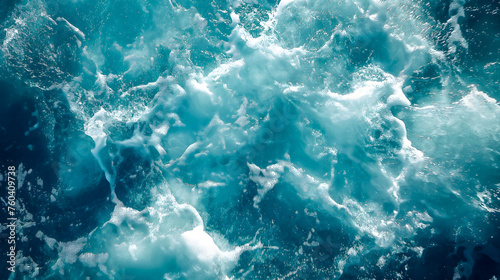 Blue sea water with foam and waves close up. Natural background.