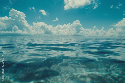 summer ocean surface with blue sky and clouds