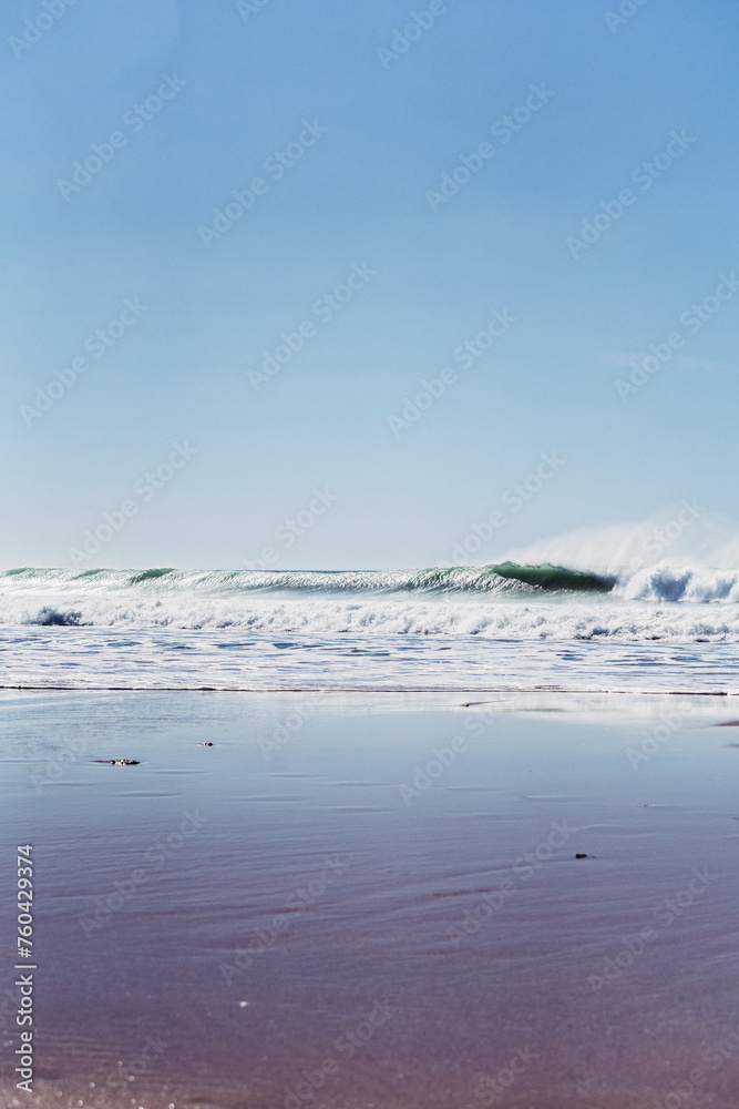 wave breaking on the seashore, high contrast, shadows