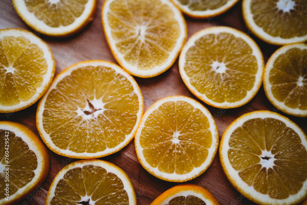 Juicy fresh orange slices on a wooden chopping board Juicy fresh orange slices on a wooden chopping board