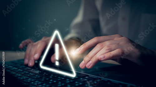Hand using laptop with showing Malware alert on screen, Concept of cyber crime and (PDPA)Personal Data Protection.