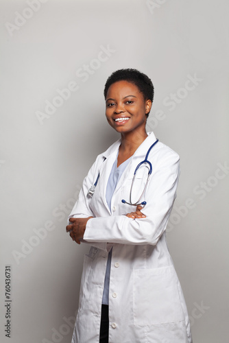 Successful doctor woman medical worker in lab coat on white background