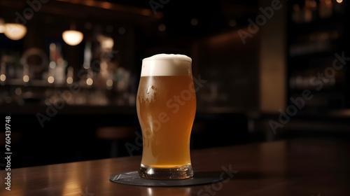 Glass of light beer on dark pub background banner