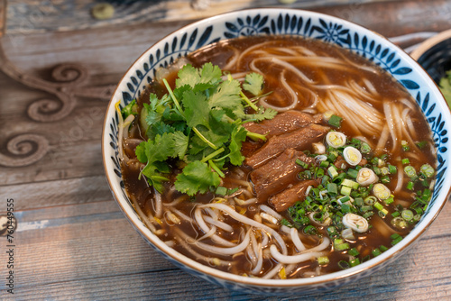 Closeup photo of beef rice noodle (pho), taken in a restaurant