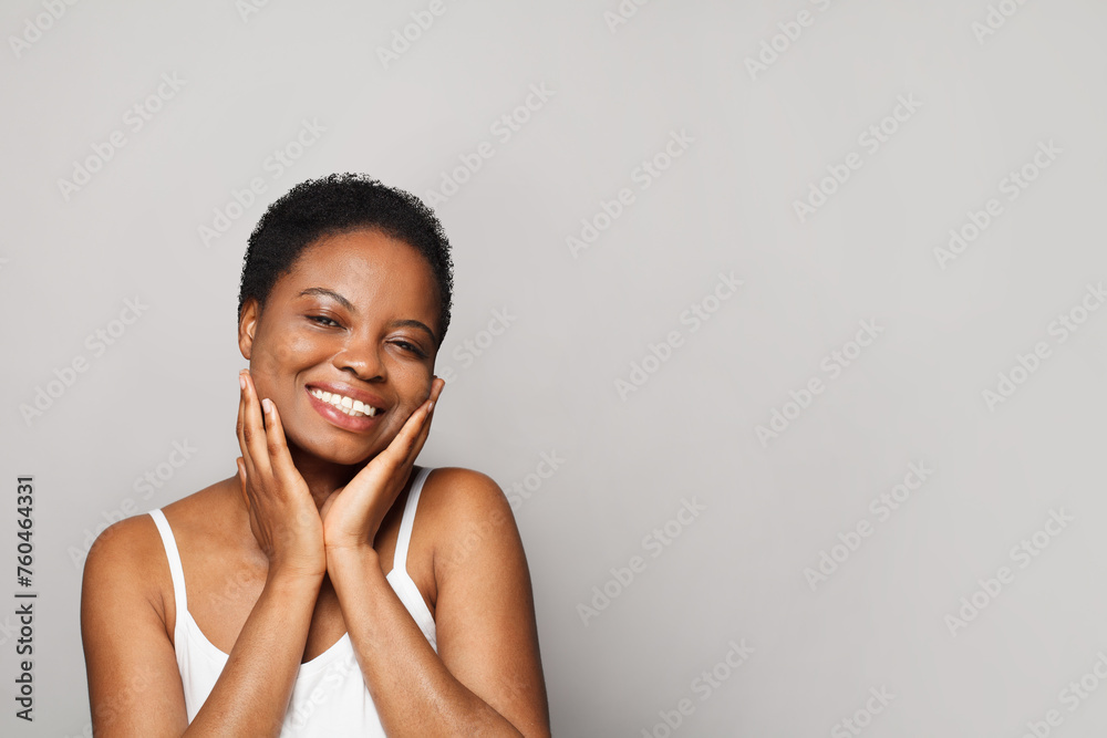 Excited wellness model woman with dark shiny skin and cute smile close-up portrait. Excited wellness model woman with dark shiny skin and cute smile close-up portrait.