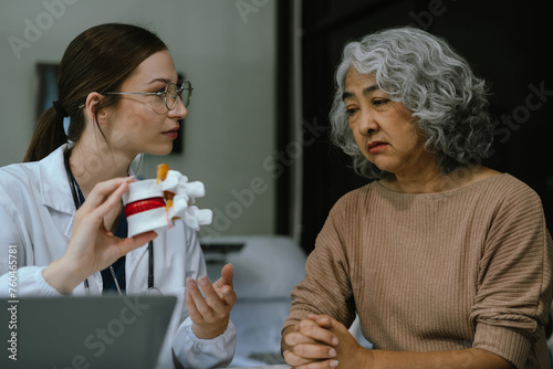 Female doctor explaining to patient results of model the process of patients. Diagnosis of diseases for Model Internal organ.
