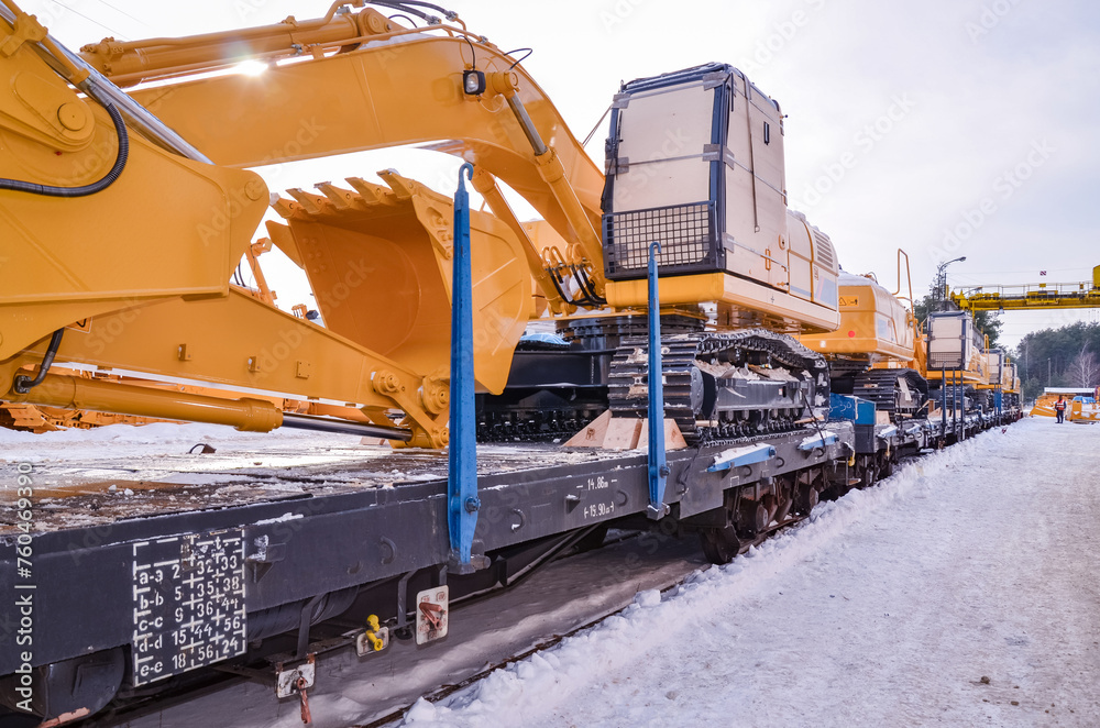 Excavators crawler transported by rail. Crawler dozers secured for rail ...