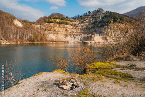 Inundated quarry, ideal for summer days of swimming. Natural phenomenon in Slovakia. Quarry or Sutovske lake. Spring atmospher