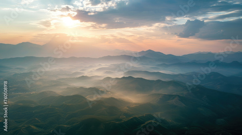 mountains with fog, clouds in the sky with a ray of sunshine, panorama