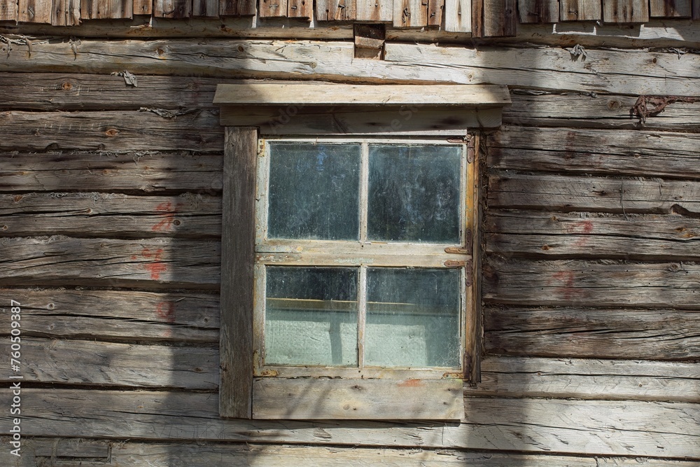 Closeup of old weathered and worn wooden planks with framed window. Closeup of old weathered and worn wooden planks with framed window.